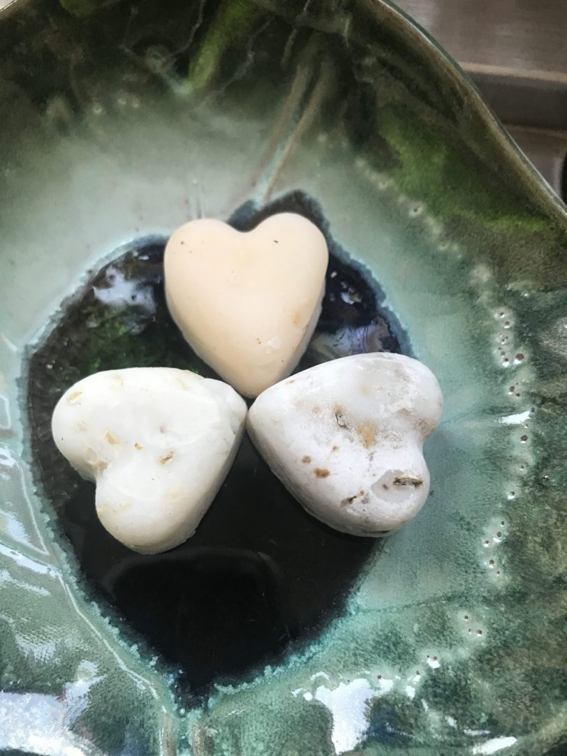 BombusLeaf Heart shaped Hand and Body Soap Scrubs on a green soap dish