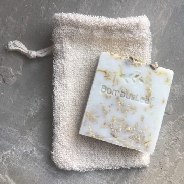Organic Unbleached Cotton Soap Pouch with chamomile, calendula and oat soap scrub on top