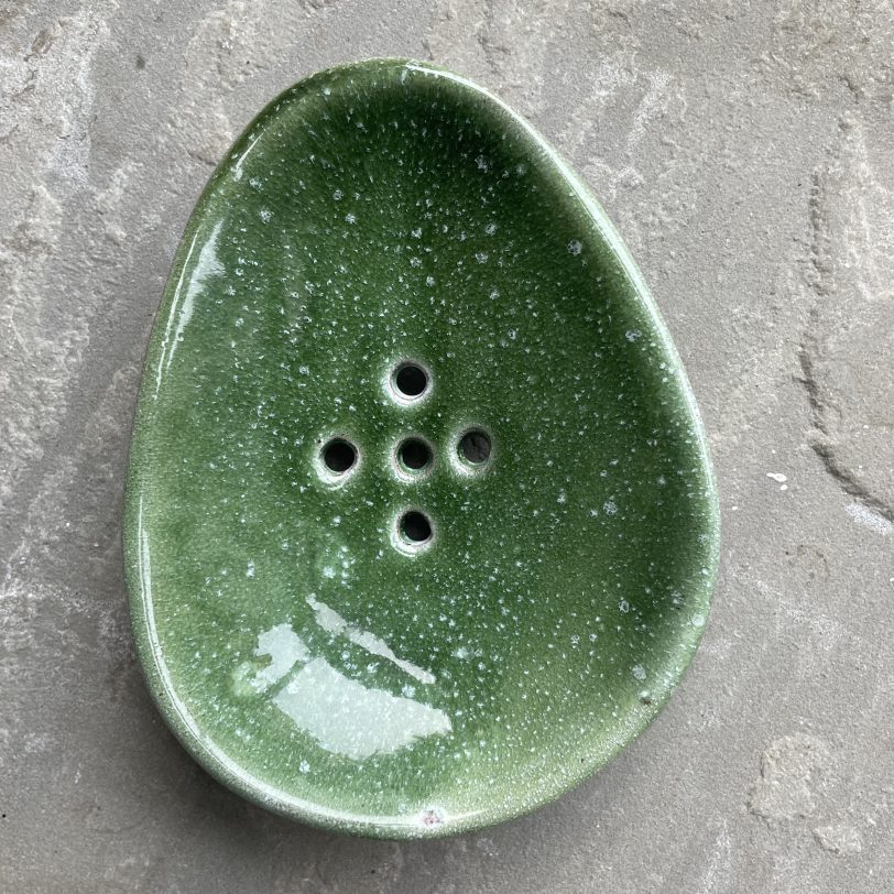 Green Handmade ceramic soap dish shaped like an avocado