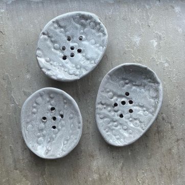 Three grey bubble embossed soap dishes
